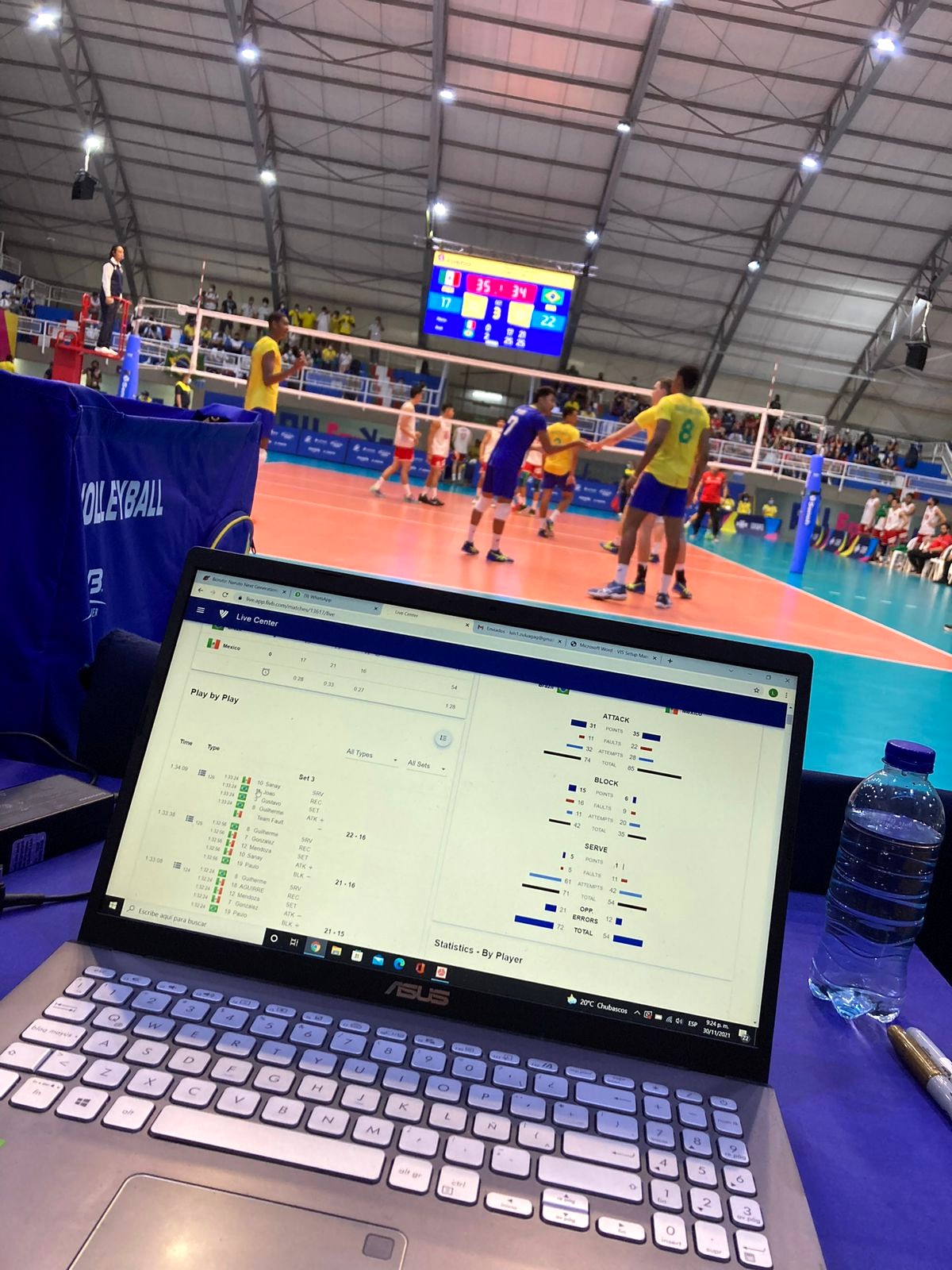 FIVB Live Center statistics open on a laptop courtside during a match